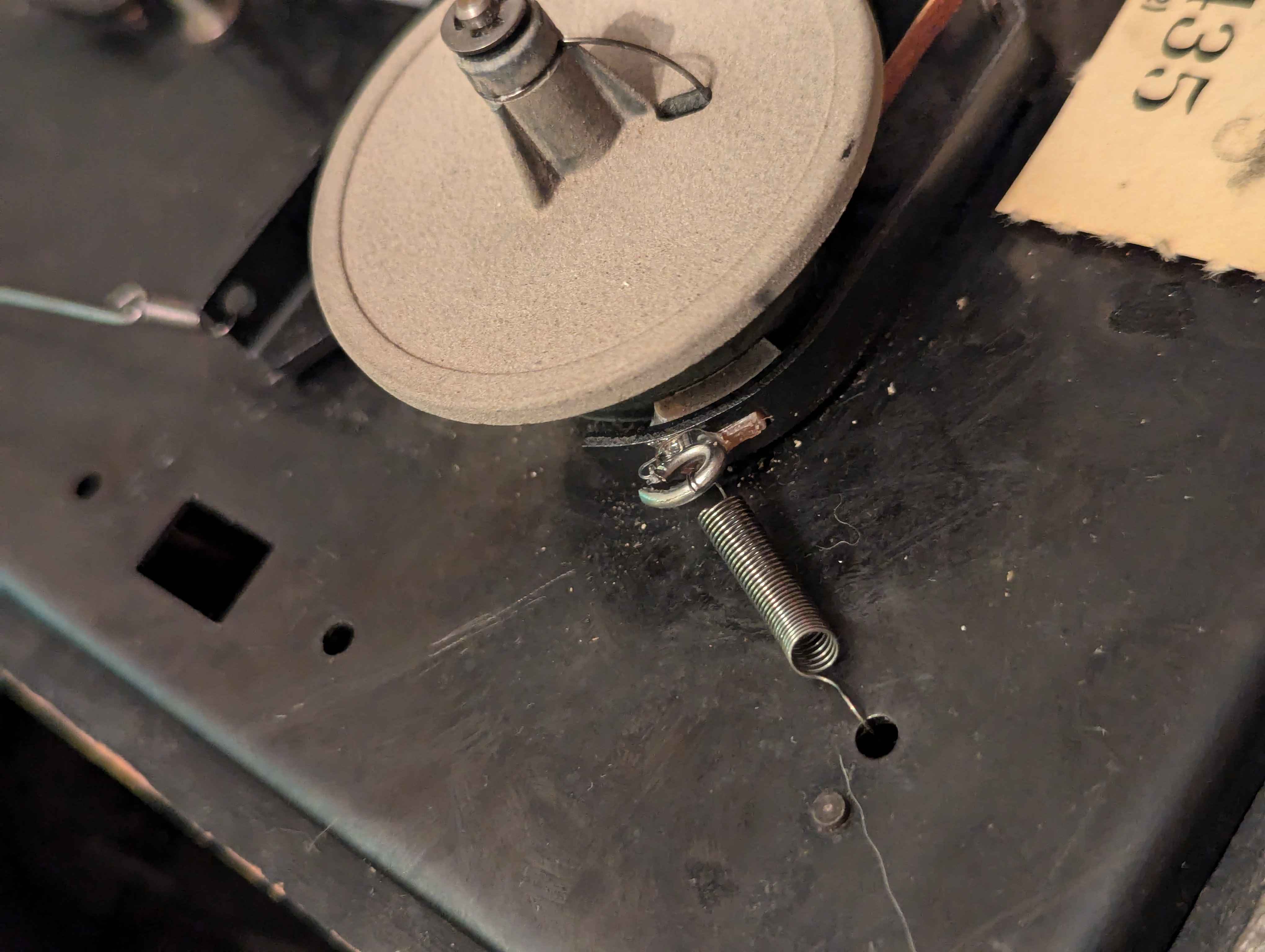 Steel wire superglued onto some metal contacts with a spring connecting it to the body of the player